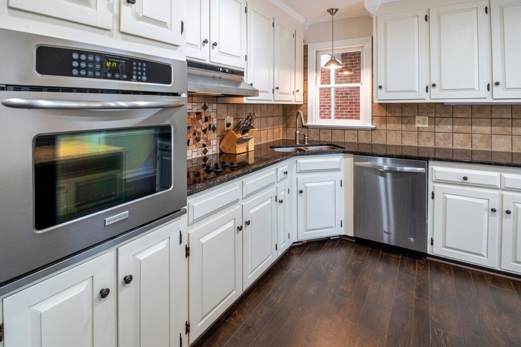 Kitchen with white cabinets and stainless appliances