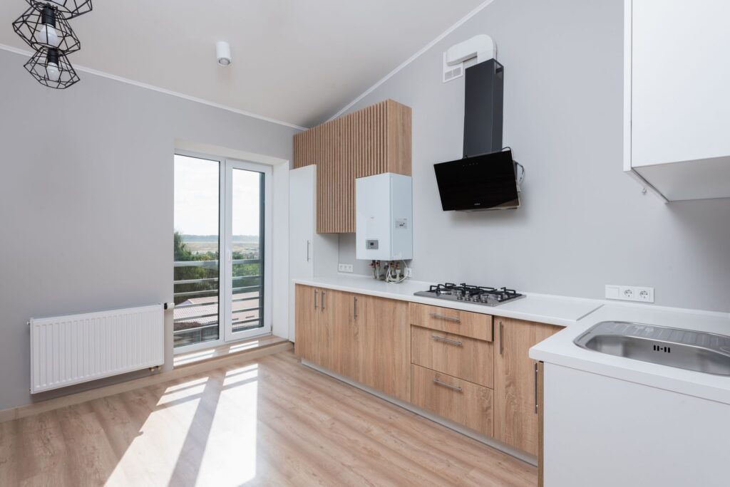 Bright kitchen with new wood-front cabinets
