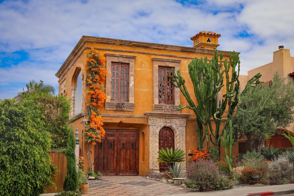 Spanish style home with palms in San Diego